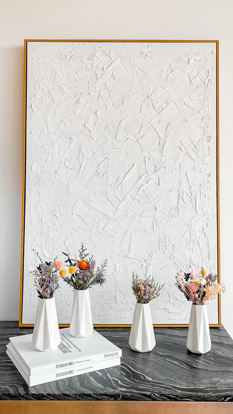 star vase with dried flowers