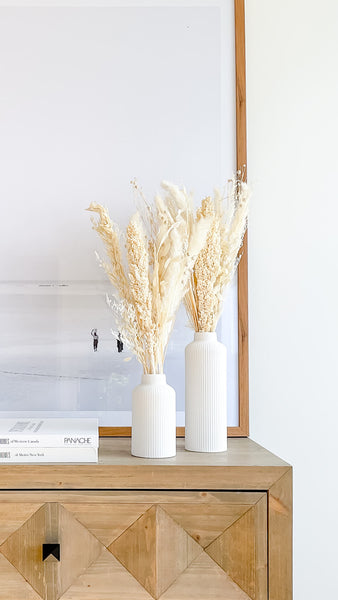 tall and short white ceramic vase with white pampas grass