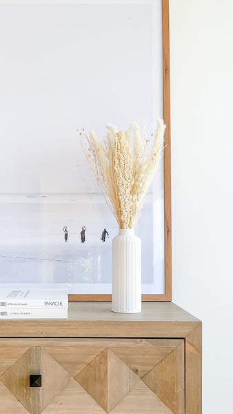 tall ceramic vase with pampas grass