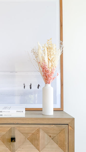 tall vase with bunny tail and pink dried flowers